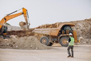 male-worker-with-bulldozer-sand-quarry